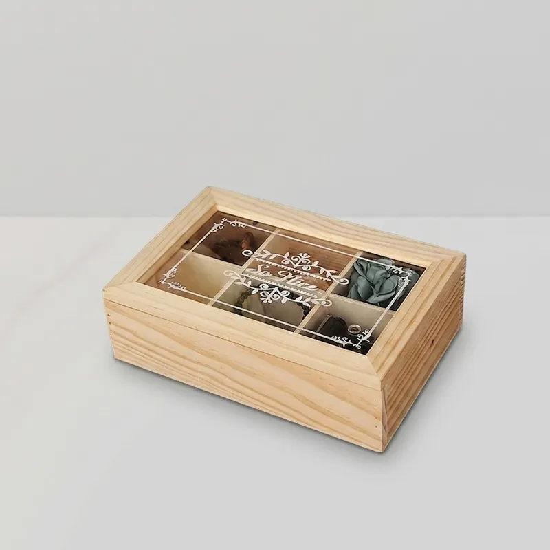 Internal detail view of open wooden box showing hinges and divider compartments