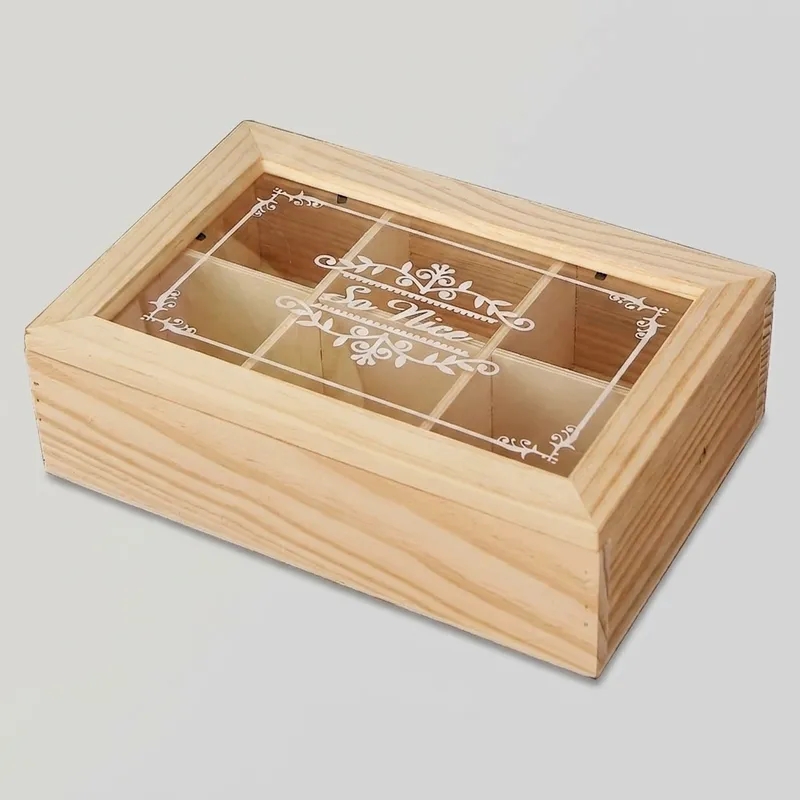 Angled high-angle view of a closed rectangular 6 compartment wooden storage box with decorative acrylic lid