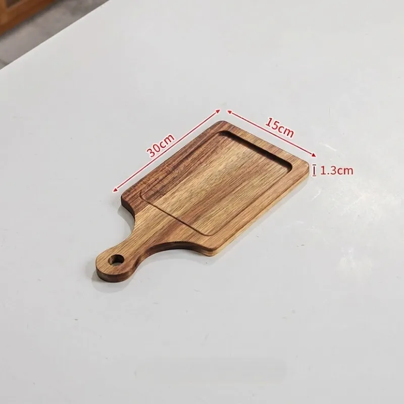 Narrow grooved wooden serving board measuring thirty by fifteen centimeters