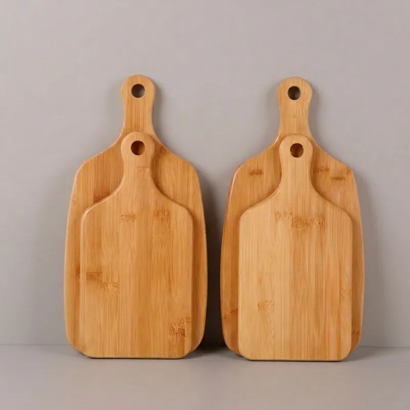 Two pairs of bamboo paddle cutting boards in different sizes
