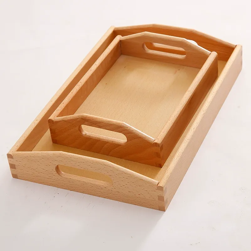 Two nested rectangular beech wood serving trays with integrated cutout handles