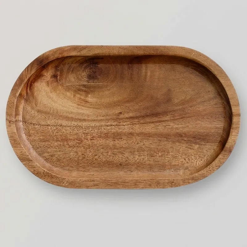 Medium brown acacia wood oval tray displaying natural wood grain