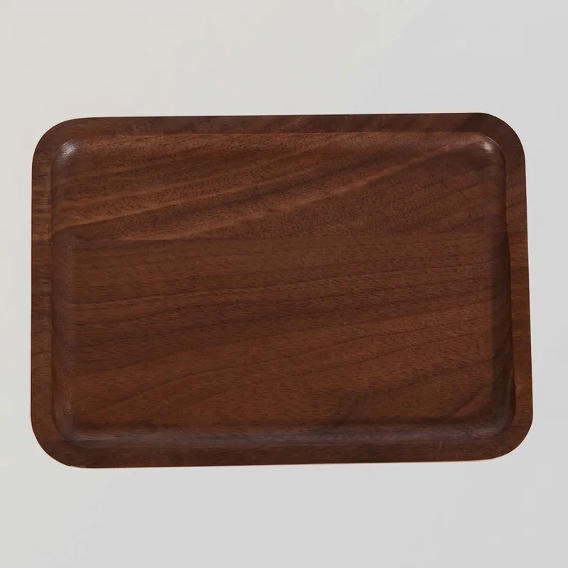 Top view of a rectangular walnut wood tray with rounded corners