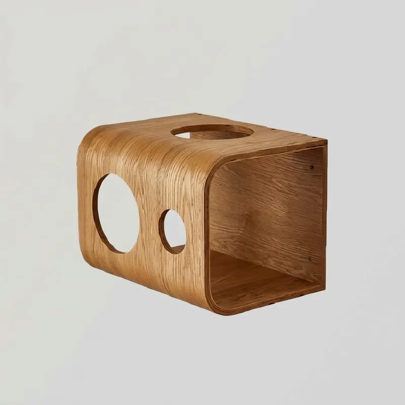 Isolated curved wooden cat condo with dual circular entry holes