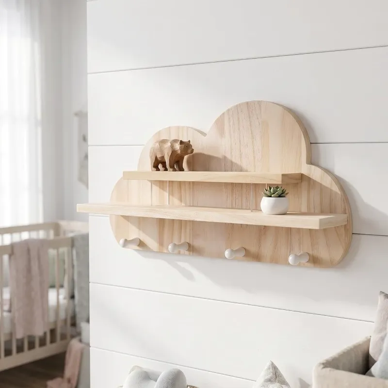 Pine wood cloud shelf holding a wooden bear figurine and succulent